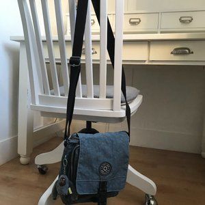 Barely Used crossbody medium travel bag light blue color by kipling